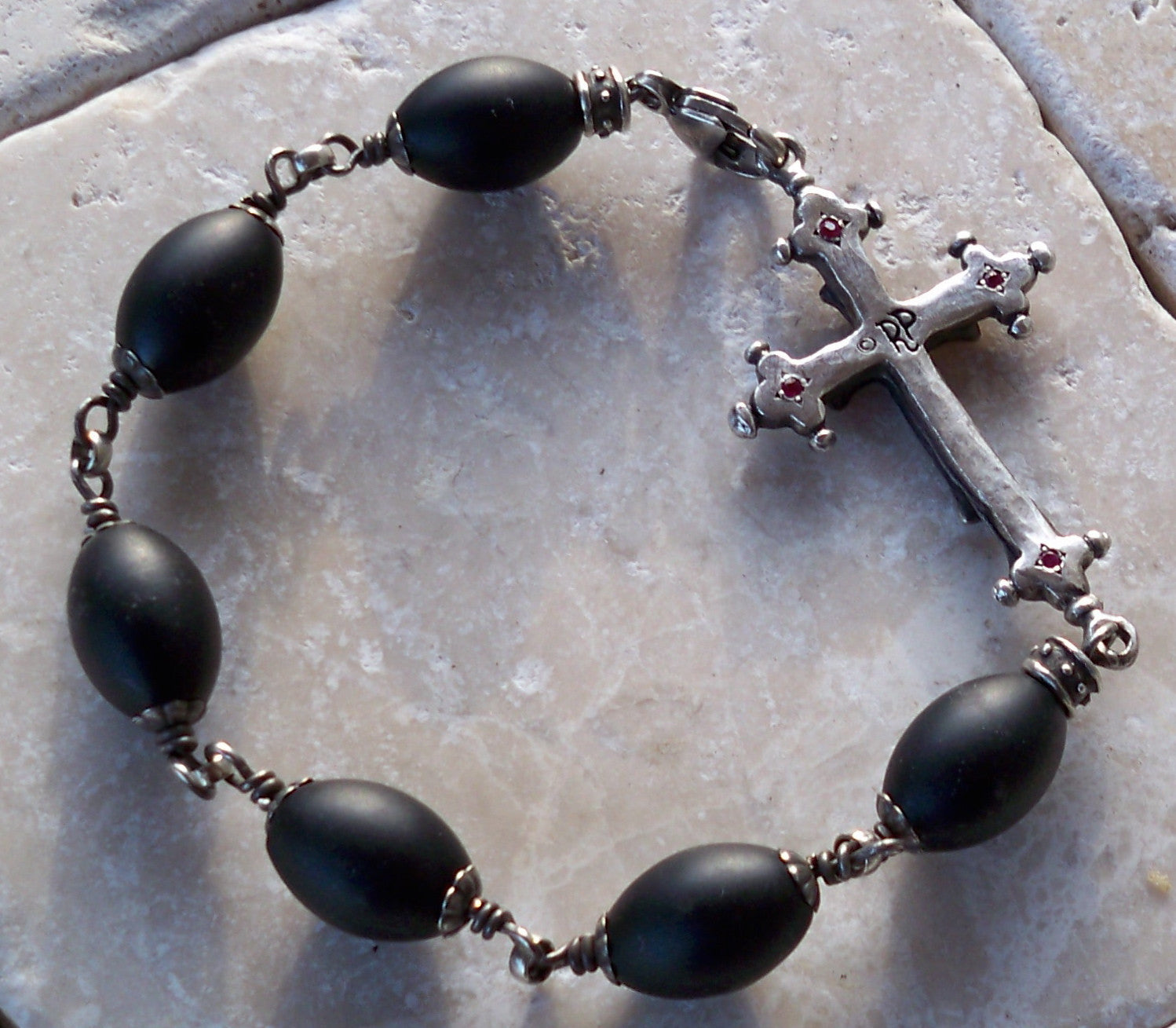 Silver cross black diamonds rubies onyx