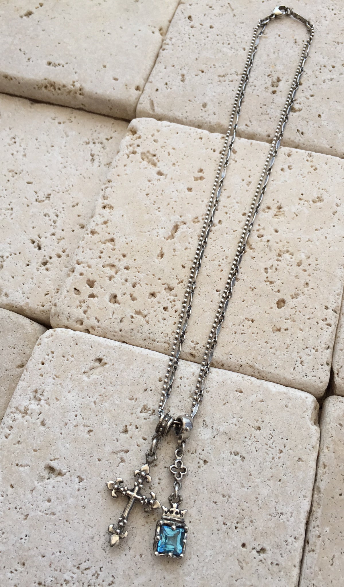 Silver Cross and Blue Topaz by Roman Paul
