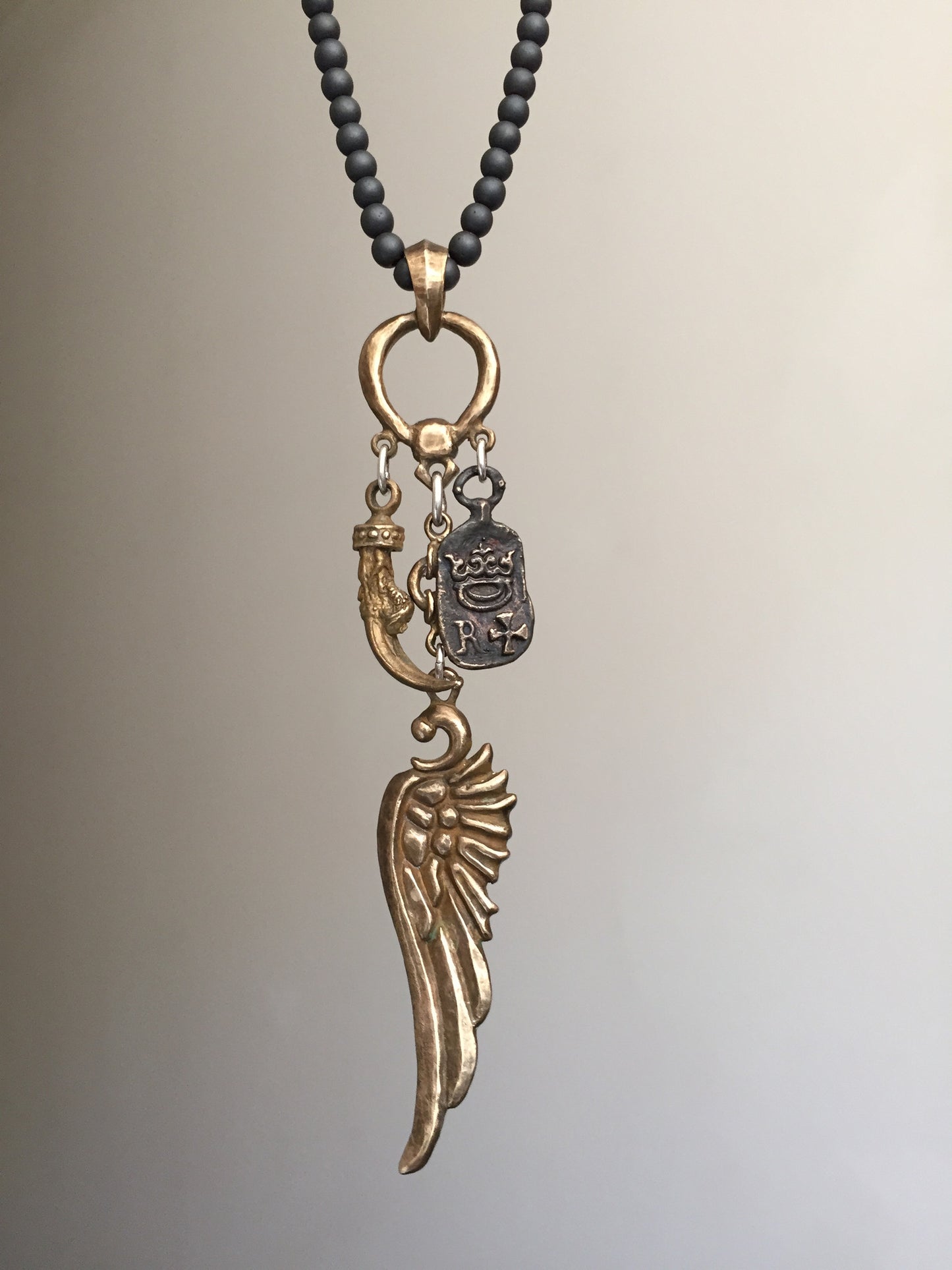 Wing, Clew and Emblem Bronze Art Necklace with Hematite Beads