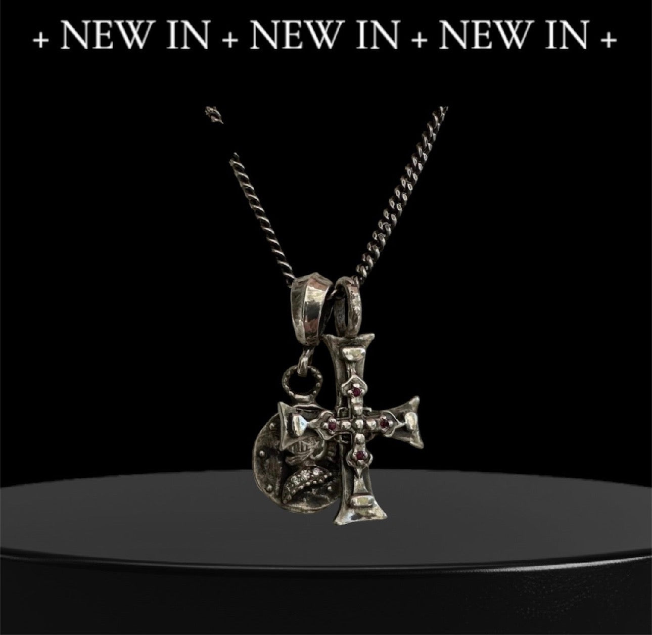 Ancient Cross & Knight Medalion

Sterling Silver Ruby Cross & Diamond Knight Medallion Double Charm Necklace
