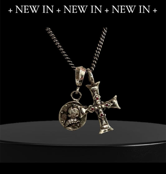 Ancient Cross & Knight Medalion

Sterling Silver Ruby Cross & Diamond Knight Medallion Double Charm Necklace