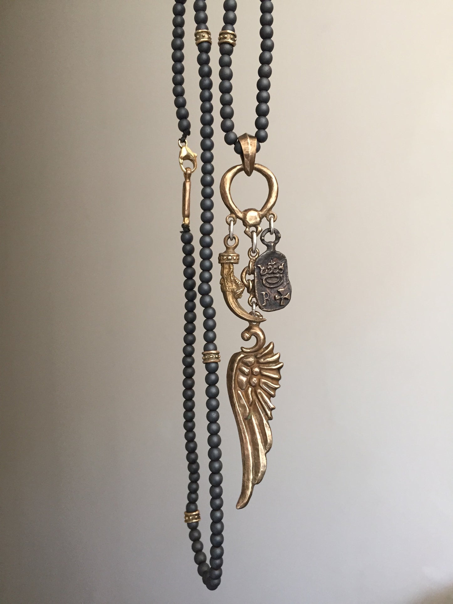 Wing, Clew and Emblem Bronze Art Necklace with Hematite Beads