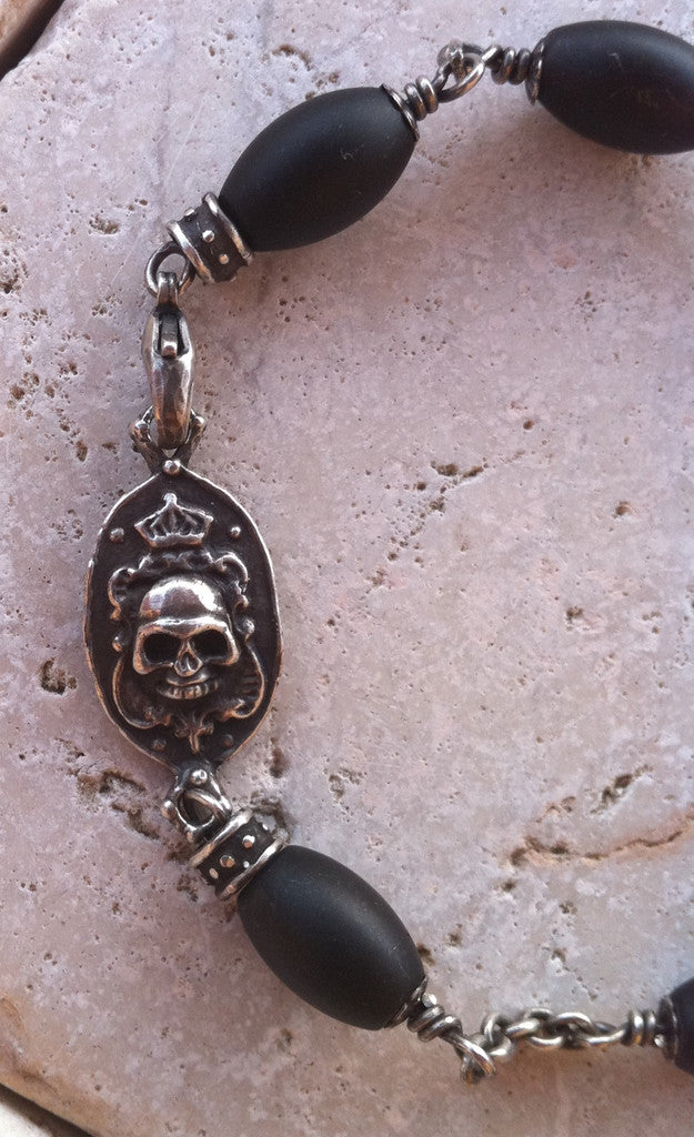 Sterling Silver Two Skull Bracelet with Oval Onyx Beads