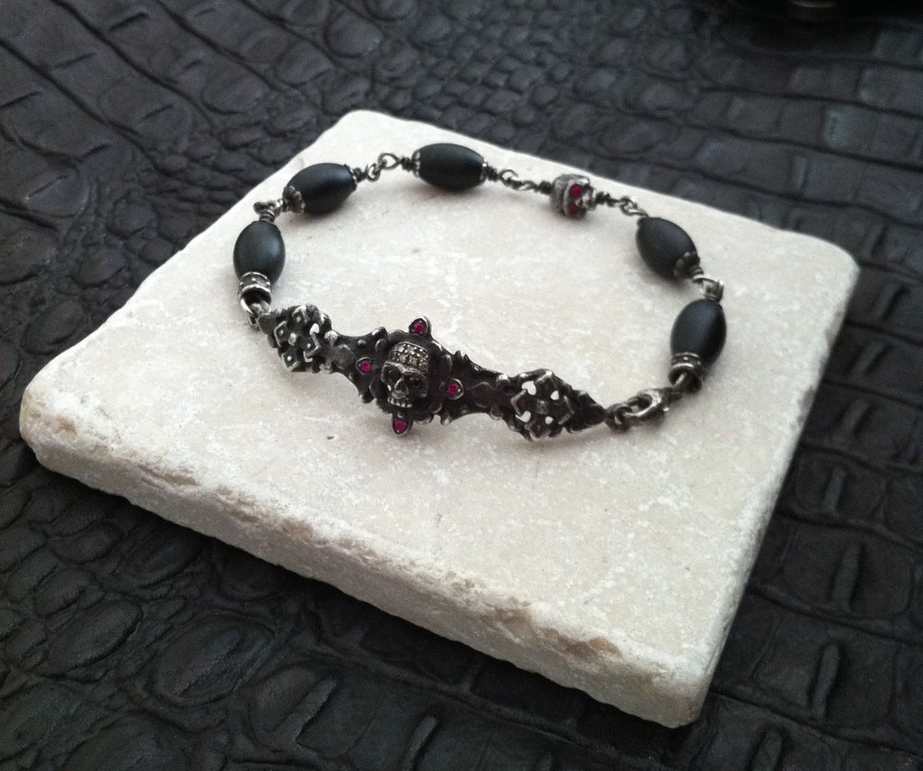 Sterling Silver Dark Antiqued Two Skull Bar Diamond & Ruby Pave Bracelet with Oval Onyx Beads