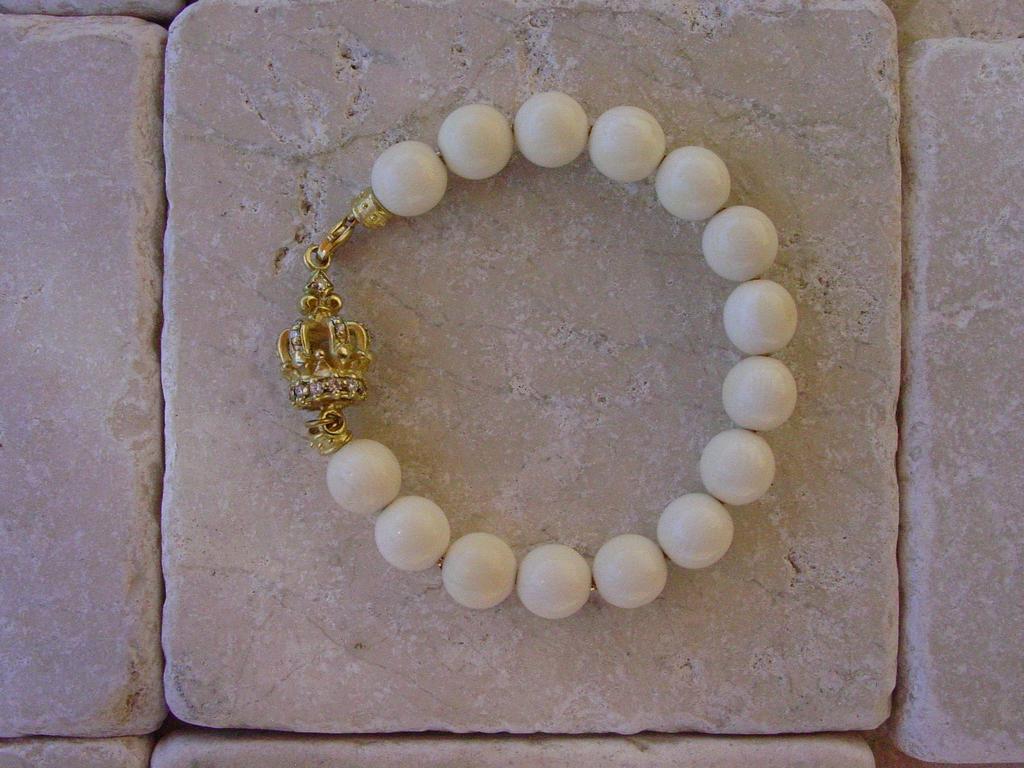 Gold Diamond Crown & Coral Beads by Roman Paul